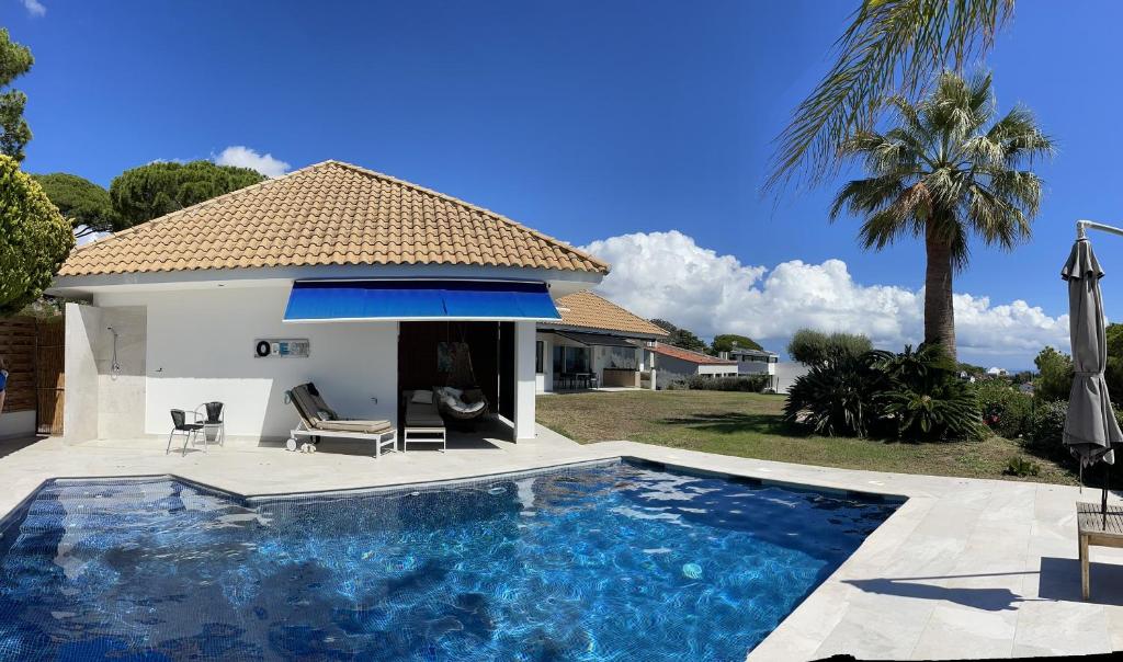 Villa exterior with pool